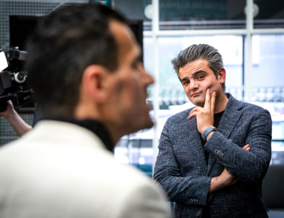 Denk MP Tunahan Kuzu looking quizzically at his colleague Farid Azarkan